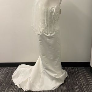 Ivory wedding dress with veil.
